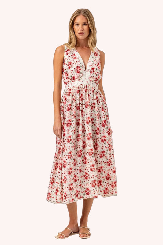 Woman wearing a floral dress on a white background